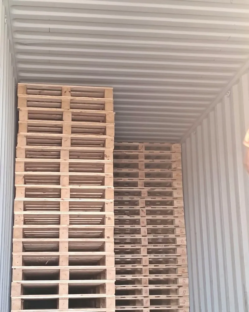 Heat treated pallets stacked inside a shipping container