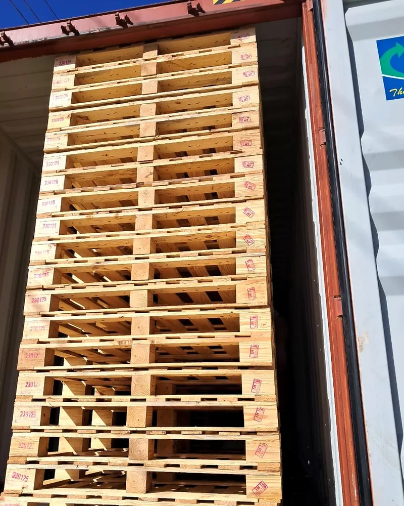 Heat treated pallets loaded neatly inside an export container