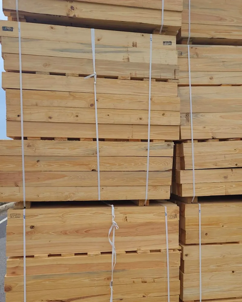 Banded stacks of graded pine lumber ready for production